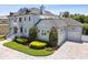 Stately home with manicured lawns, a three-car garage, and a balcony overlooking the front yard at 2604 S Bryant Cir, Tampa, FL 33629