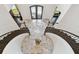 Elegant foyer with marble flooring, curved staircases, and wrought iron railings at 2604 S Bryant Cir, Tampa, FL 33629