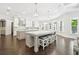 Spacious gourmet kitchen featuring a large center island, stainless steel appliances, and custom cabinetry at 2604 S Bryant Cir, Tampa, FL 33629