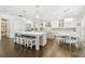 Spacious open concept kitchen with double islands, stainless steel appliances, breakfast nook and dark hardwood floors at 2604 S Bryant Cir, Tampa, FL 33629