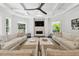 Bright living room with high ceilings, fireplace, custom ceiling fan, and neutral color palette at 2604 S Bryant Cir, Tampa, FL 33629