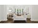 Bright living room with hardwood floors, decorative columns, and French doors offers a sophisticated space at 2604 S Bryant Cir, Tampa, FL 33629