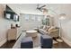 Modern living room with a large sectional, stylish decor, and a cozy ambiance for comfortable living at 2604 S Bryant Cir, Tampa, FL 33629