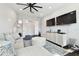 Inviting living room with a large sectional, modern decor, and ample space for relaxation and entertainment at 2604 S Bryant Cir, Tampa, FL 33629