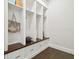 Well-organized mudroom featuring custom-built cubbies, drawers, and wooden bench at 2604 S Bryant Cir, Tampa, FL 33629