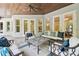 Inviting covered outdoor living space with comfortable seating and view of the pool at 2604 S Bryant Cir, Tampa, FL 33629