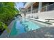 Beautiful pool area with lush landscaping and a clear view of the water at 2604 S Bryant Cir, Tampa, FL 33629