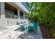 Beautiful pool area with lush landscaping, lounge chairs, and stairs to outdoor space at 2604 S Bryant Cir, Tampa, FL 33629