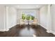 Bright sitting room with hardwood floors and large window offering beautiful outside views at 2604 S Bryant Cir, Tampa, FL 33629