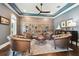 Comfortable sitting room with wood floors, built-in bookcase, and custom ceiling at 2604 S Bryant Cir, Tampa, FL 33629