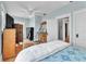 Spacious bedroom features hardwood floors, natural light, and a ceiling fan at 2638 Burlington N Ave, St Petersburg, FL 33713