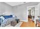 Bright bedroom showcasing hardwood floors and comfortable furnishings at 2638 Burlington N Ave, St Petersburg, FL 33713