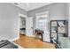 Bright bedroom features hardwood floors, neutral gray paint, closet and natural light from the window at 2638 Burlington N Ave, St Petersburg, FL 33713