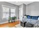 Cozy bedroom with hardwood floors, a daybed, and plenty of natural light at 2638 Burlington N Ave, St Petersburg, FL 33713