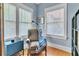 Cozy nook with chair and lamp next to windows for ample natural light at 2638 Burlington N Ave, St Petersburg, FL 33713