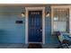 Stylish blue front door with decorative accents and classic hardware, offering a welcoming entrance at 2638 Burlington N Ave, St Petersburg, FL 33713