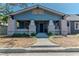 Charming blue craftsman-style home featuring a covered front porch and well-maintained landscaping at 2638 Burlington N Ave, St Petersburg, FL 33713