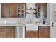 Farmhouse sink with stone countertops and custom cabinetry in this newly remodeled kitchen at 2638 Burlington N Ave, St Petersburg, FL 33713