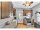 Kitchen with custom wood cabinets, stainless appliances, and granite countertops at 2638 Burlington N Ave, St Petersburg, FL 33713