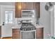 This kitchen features custom wood cabinets, granite countertops and stainless steel appliances at 2638 Burlington N Ave, St Petersburg, FL 33713