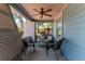 Relaxing covered porch with comfortable seating, ceiling fan, and stylish brick columns at 2638 Burlington N Ave, St Petersburg, FL 33713