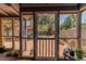 Relaxing screened-in porch with a view of the fenced backyard and mature trees at 2638 Burlington N Ave, St Petersburg, FL 33713