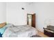 Bright bedroom with bare white walls and hardwood floors at 3093 Woodpine Cir, Sarasota, FL 34231