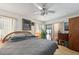 Comfortable bedroom featuring a ceiling fan and sliding glass doors to the lanai at 3093 Woodpine Cir, Sarasota, FL 34231