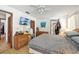 Bright bedroom featuring a ceiling fan, and wicker dressers at 3093 Woodpine Cir, Sarasota, FL 34231