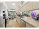 Spacious kitchen with stainless steel appliances, offering plenty of counter space and natural light at 3093 Woodpine Cir, Sarasota, FL 34231