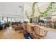 Bright and spacious open floor plan featuring an eat-in kitchen bar and a ceiling fan at 3093 Woodpine Cir, Sarasota, FL 34231