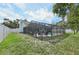 Relax in this screened-in pool with ample seating, overlooking the spacious backyard at 3093 Woodpine Cir, Sarasota, FL 34231