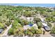 Stunning aerial view of the property, showcasing lush landscaping and its proximity to the bay at 316 5Th N Ave, Safety Harbor, FL 34695