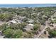 Charming neighborhood featuring tree-lined streets and homes near a beautiful waterfront with blue skies at 316 5Th N Ave, Safety Harbor, FL 34695