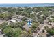 Aerial view showing the property with the arrow indicator in a leafy neighborhood setting near the water at 316 5Th N Ave, Safety Harbor, FL 34695