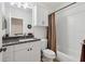 Full bathroom with white cabinets, vanity, and tub with shower at 316 5Th N Ave, Safety Harbor, FL 34695