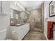 Modern bathroom featuring a glass-enclosed shower and a double vanity at 316 5Th N Ave, Safety Harbor, FL 34695
