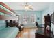 Comfortable bedroom with a bunk bed, desk area, natural light, and neutral colored walls and hardwood floors at 316 5Th N Ave, Safety Harbor, FL 34695