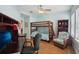 Bright and spacious bedroom with a bunk bed, desk and hardwood floors at 316 5Th N Ave, Safety Harbor, FL 34695