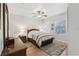 Well-lit bedroom featuring a ceiling fan and beautiful hardwood floors at 316 5Th N Ave, Safety Harbor, FL 34695