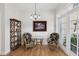 Charming breakfast nook featuring a glass table, wicker chairs, and decorative shelving with natural light at 316 5Th N Ave, Safety Harbor, FL 34695