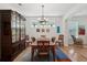 Formal dining room features hardwood floors, a classic chandelier, and ample natural light at 316 5Th N Ave, Safety Harbor, FL 34695
