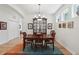 Dining room featuring a wooden table, chairs, and elegant built-in storage with natural light at 316 5Th N Ave, Safety Harbor, FL 34695