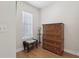 Bedroom dresser with full view of wicker chair and side table at 316 5Th N Ave, Safety Harbor, FL 34695
