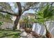 Charming home with a lush front yard, mature trees, and a inviting covered porch at 316 5Th N Ave, Safety Harbor, FL 34695