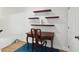 Cozy office space with decorative shelves and a writing desk on top of the blue rug at 316 5Th N Ave, Safety Harbor, FL 34695