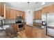 Functional kitchen boasts an island with granite countertops and stainless steel appliances at 316 5Th N Ave, Safety Harbor, FL 34695