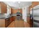 Well-equipped kitchen with wood cabinetry, granite countertops, and stainless steel appliances at 316 5Th N Ave, Safety Harbor, FL 34695