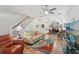 Spacious living room with hardwood floors, stairway access, and an open flow to the dining area at 316 5Th N Ave, Safety Harbor, FL 34695