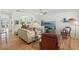 Bright and airy living room with hardwood floors, ceiling fan, and comfortable furnishings at 316 5Th N Ave, Safety Harbor, FL 34695